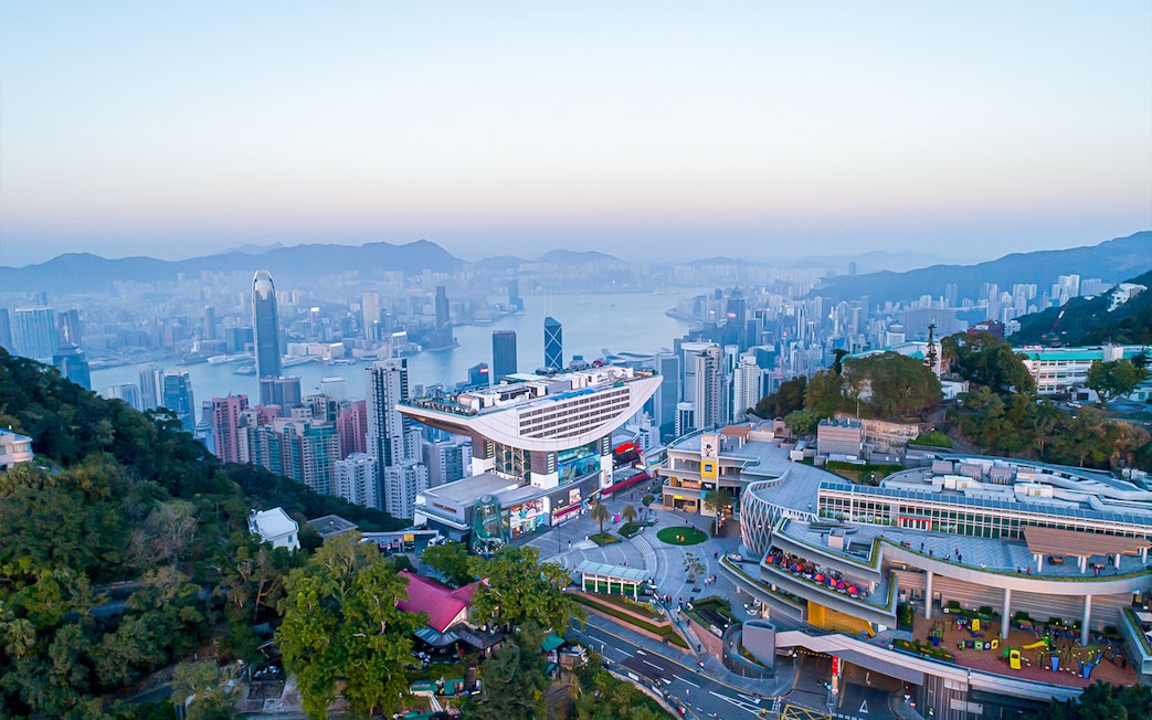 Peak Tram and Sky Terrace 428 overlooking Hong Kong skyline.