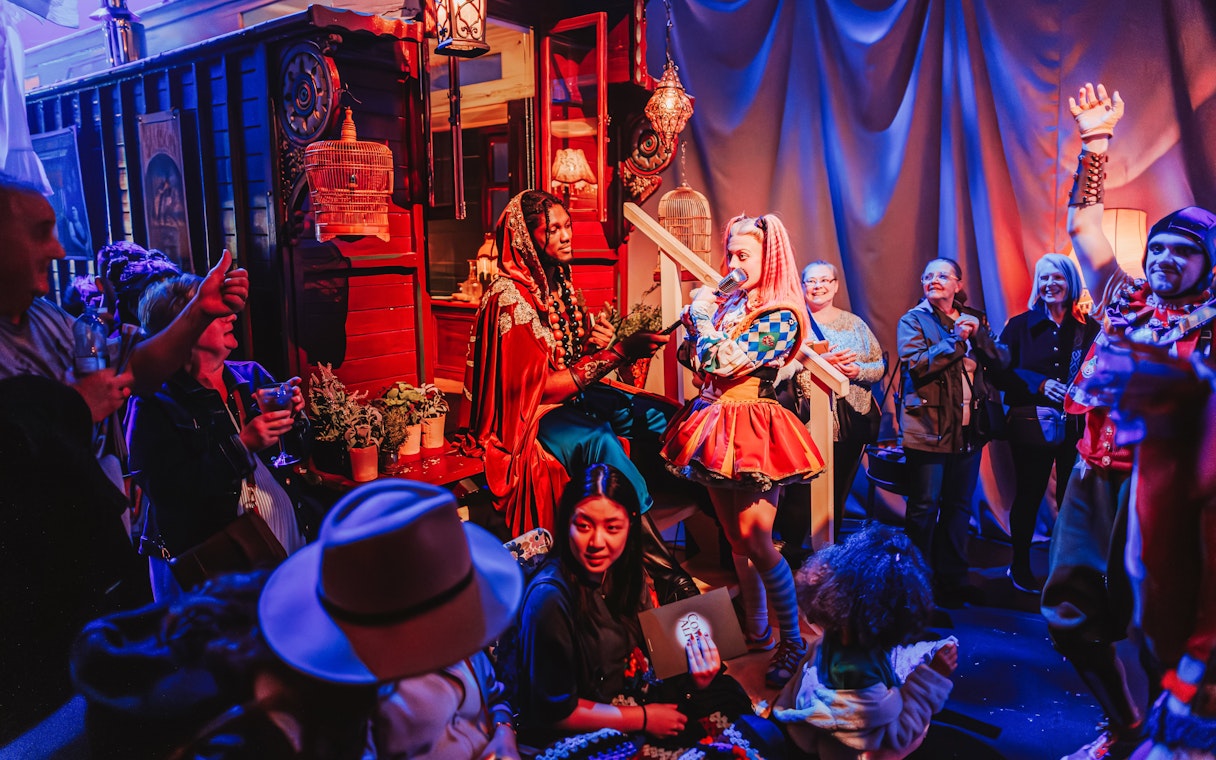 Performers interacting with audience during Come Alive Westend stage show.