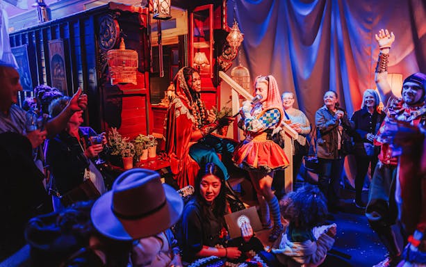 Performers interacting with audience during Come Alive Westend stage show.