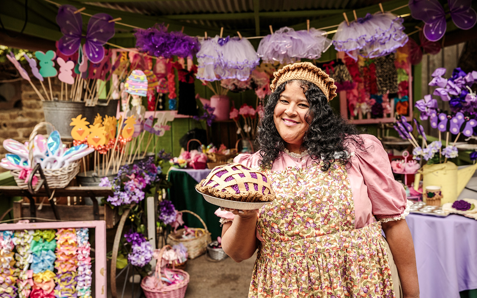 Vendor holding boysenberry pie at Knott's Boysenberry Festival, Knott's Berry Farm.