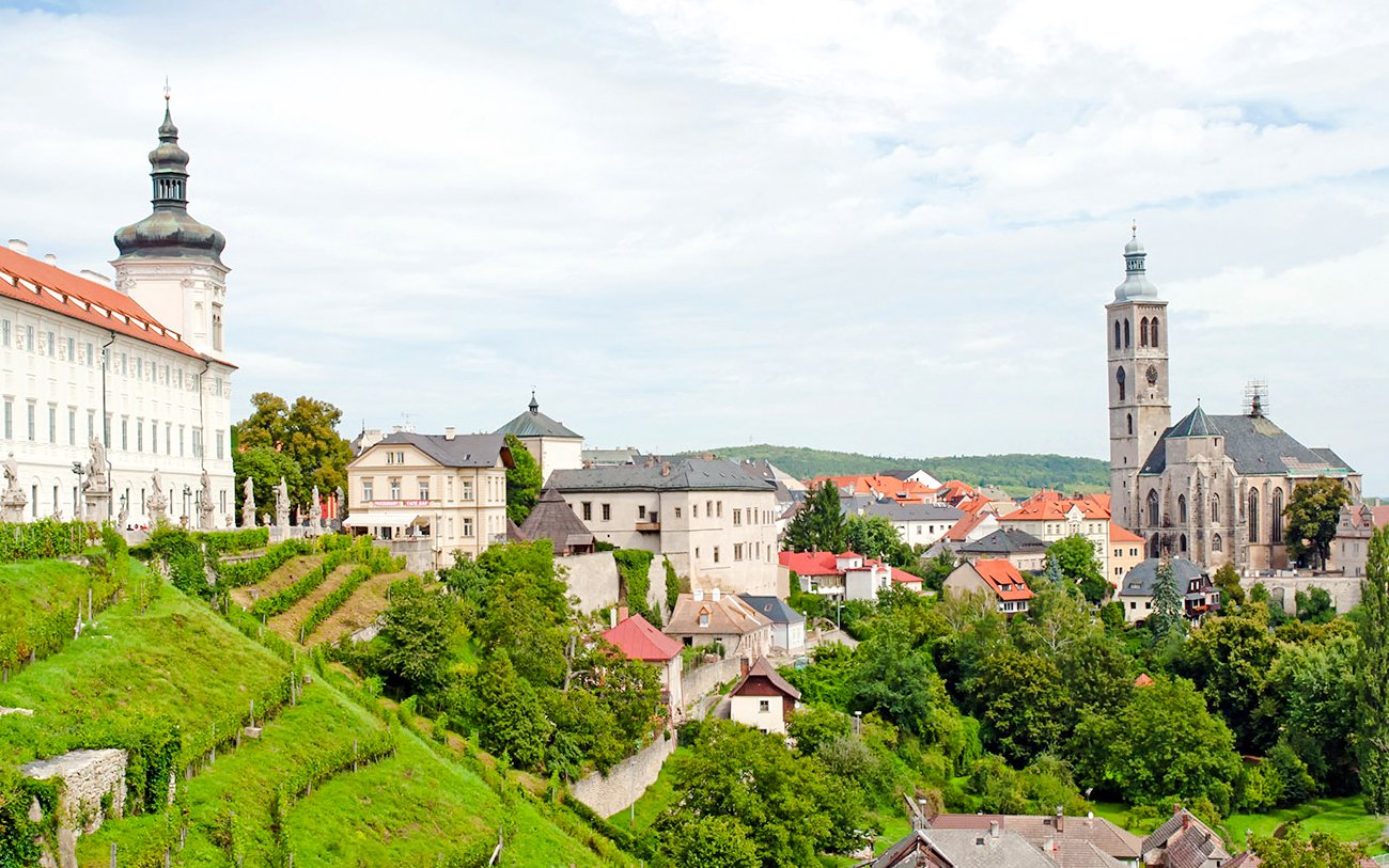 Panoramic view of Kutna Hora with St. Barbara's Church and surrounding historic buildings.