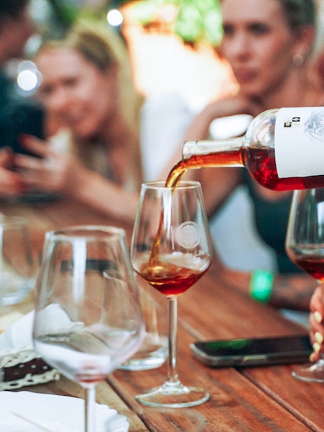 Wine being poured into glasses during Krka National Park tour.