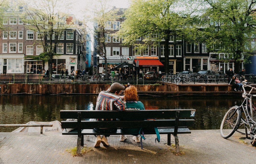 Couple walking through Jordaan neighborhood in Amsterdam during Valentine's Day.