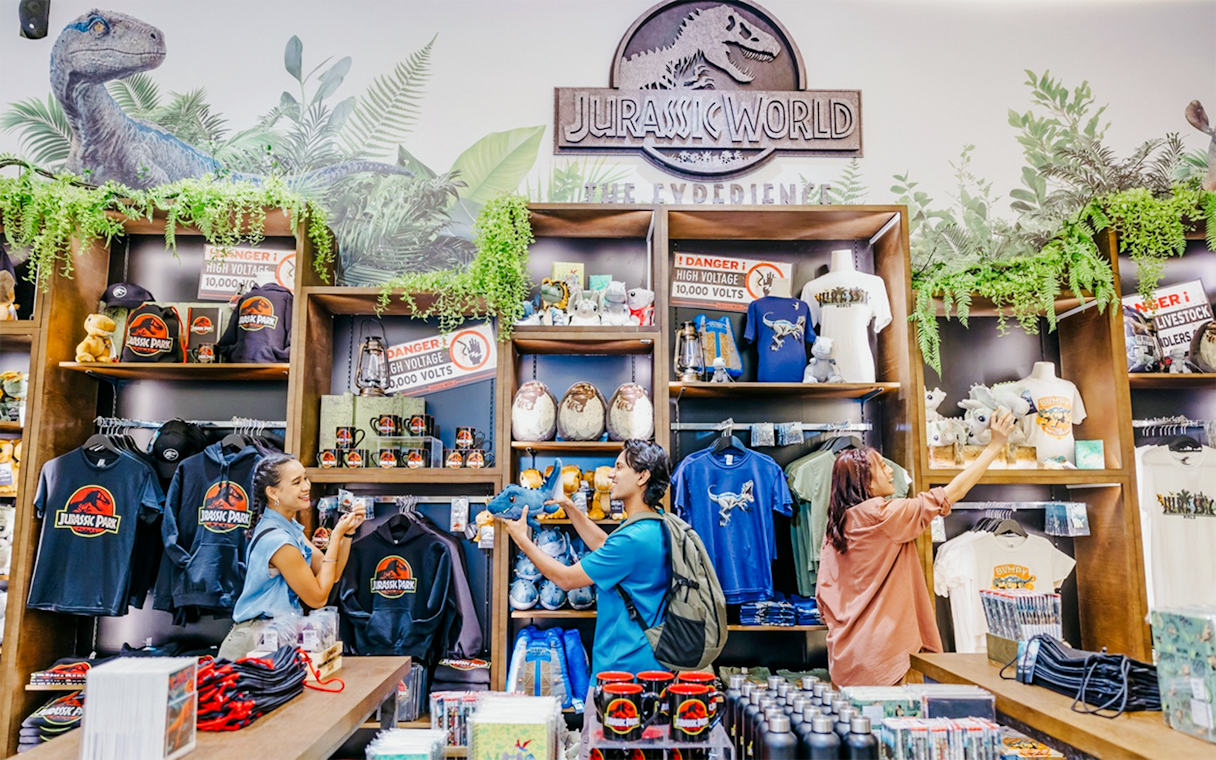 Visitors exploring Jurassic World merchandise at Gardens by the Bay.