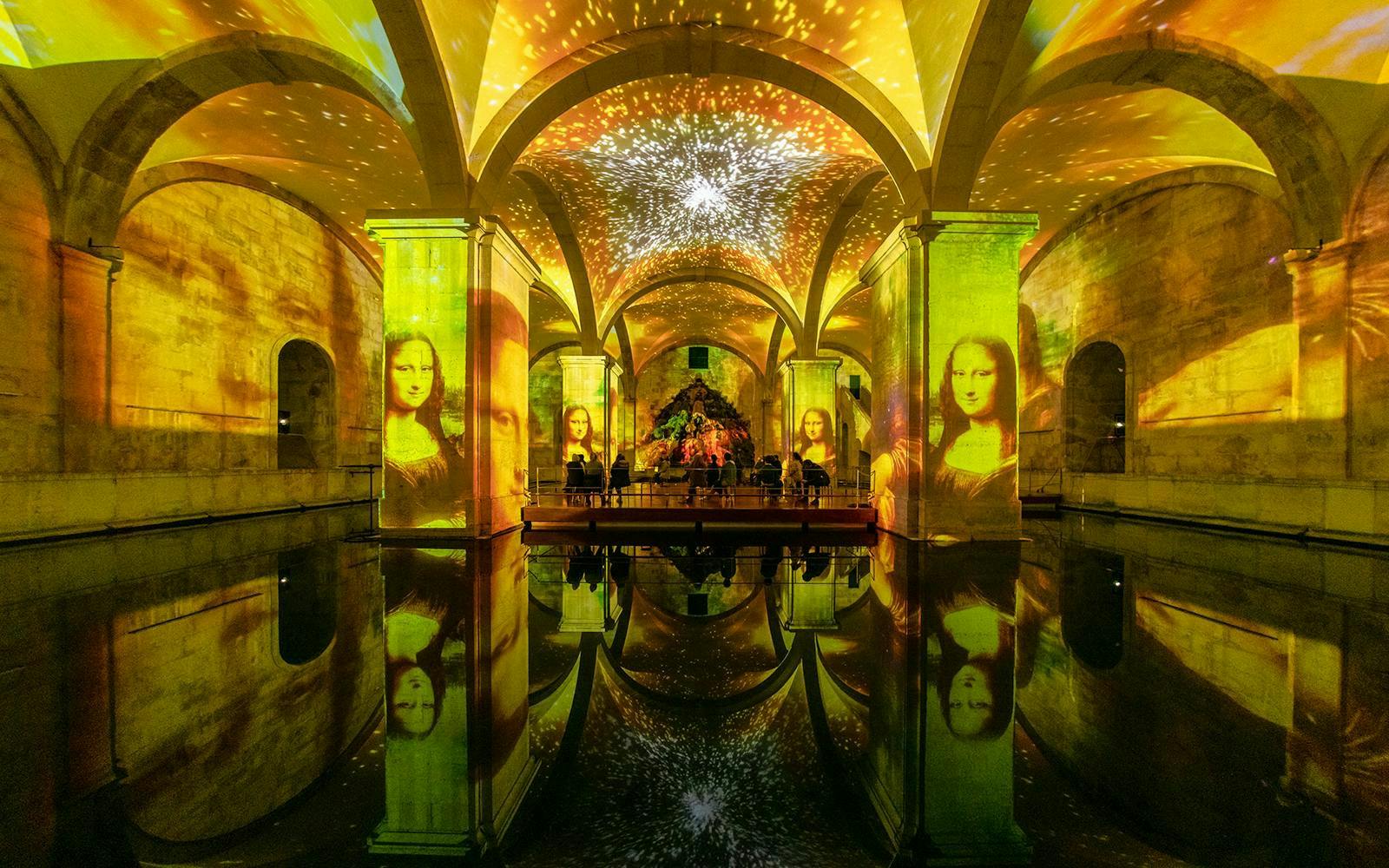 Da Vinci and Michelangelo art projections in a Lisbon exhibition hall.