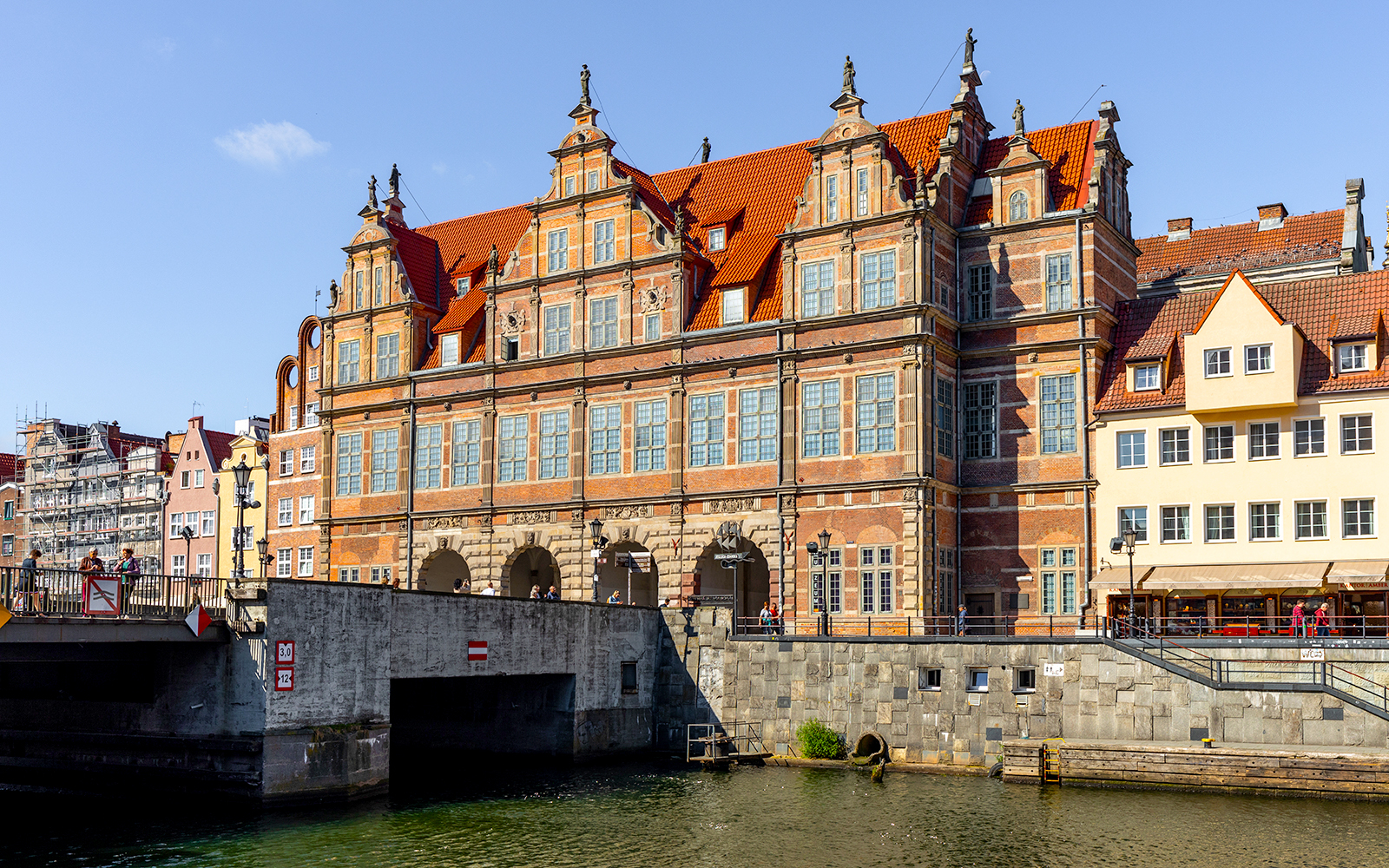 Historic building along the Motława River in Gdansk, Poland, viewed from a kayak.