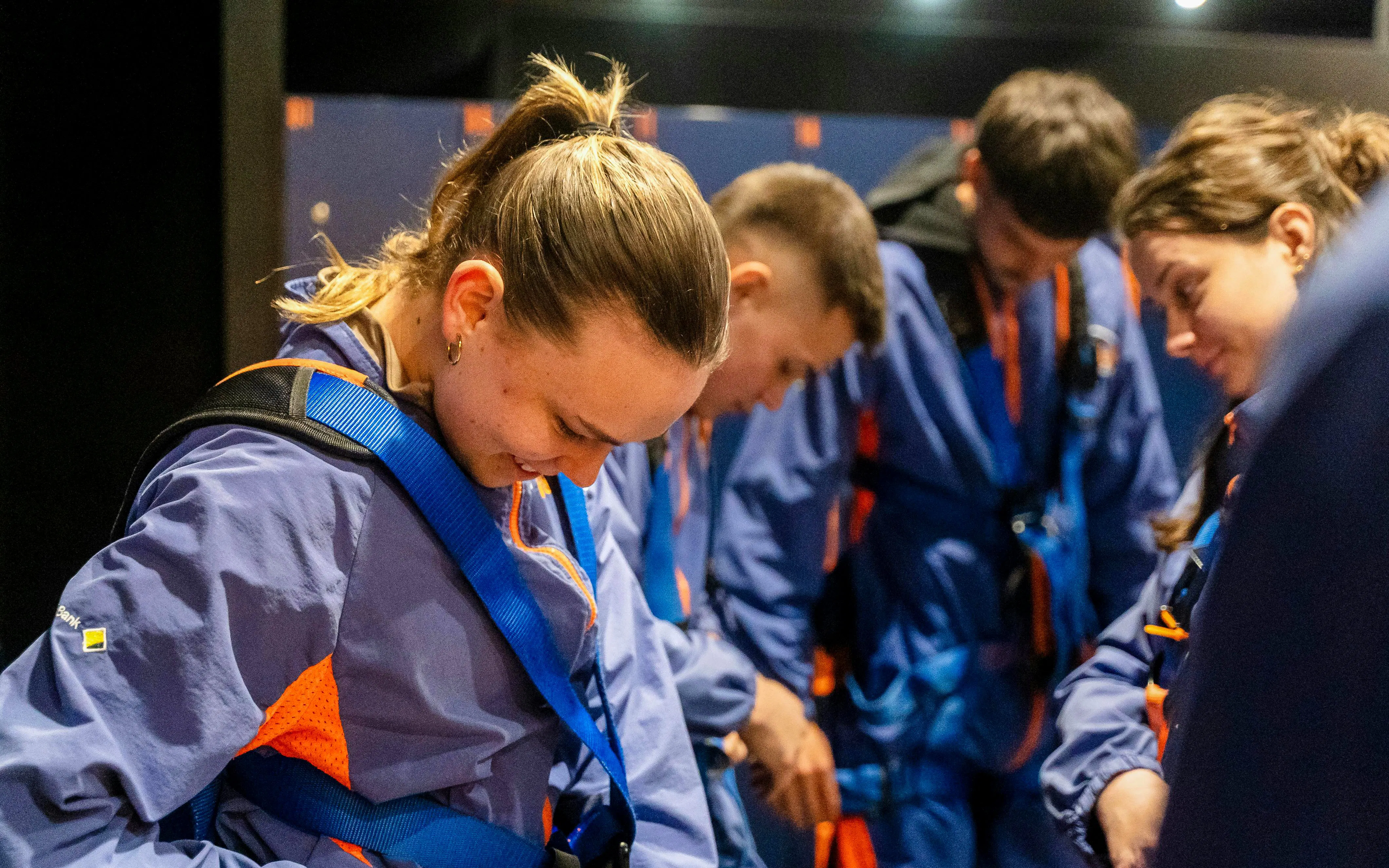 Participants preparing for Adelaide Oval roof climb in safety gear.