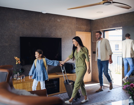 Guests enjoying a luxurious hotel stay with a stunning city view from the balcony