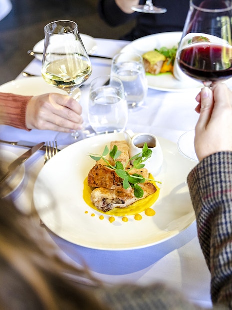 Dining at Garden Restaurant, NGV International, Melbourne with wine and gourmet dishes.