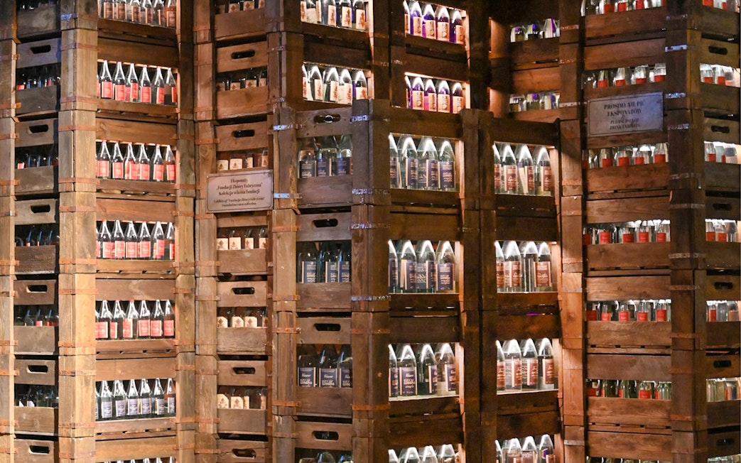 Crates of vodka bottles displayed at a museum in Krakow.