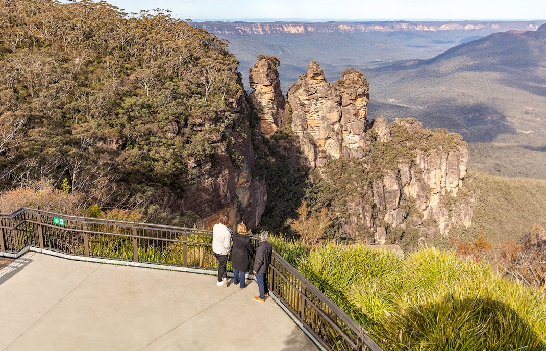 Visitors at Echo Point viewing the Three Sisters rock formation in Blue Mountains, Australia.