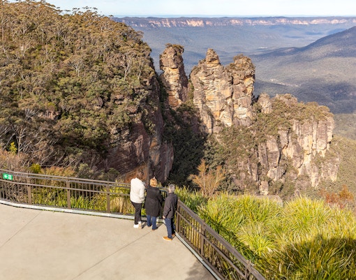 Visitors at Echo Point viewing the Three Sisters rock formation in Blue Mountains, Australia.