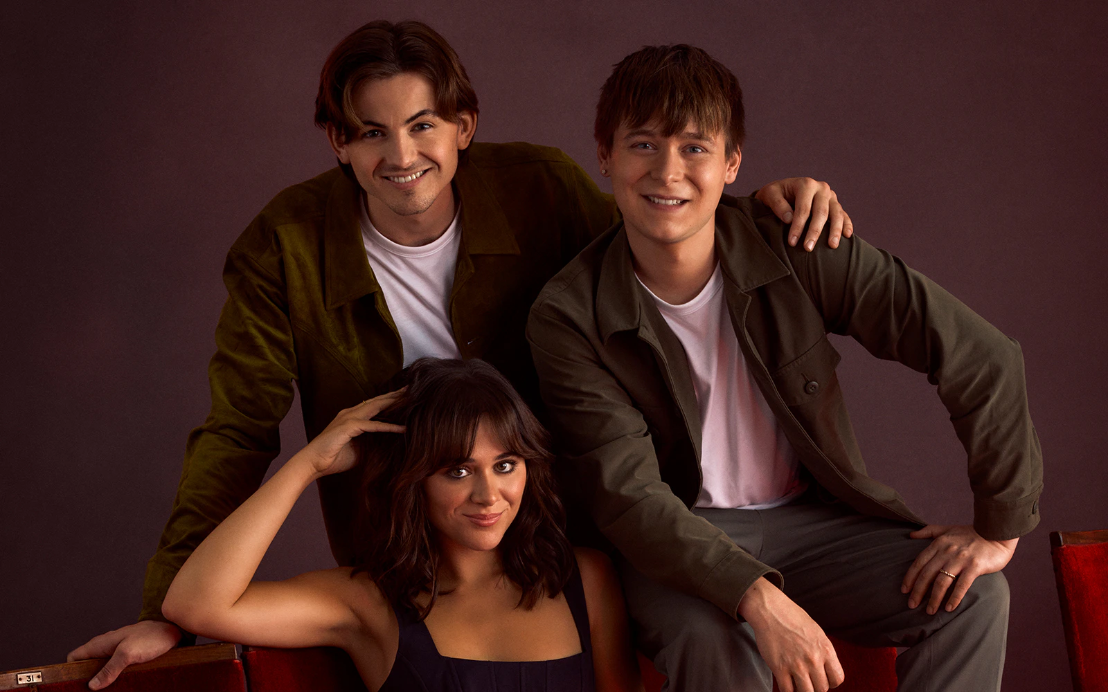 Three actors from "Stranger Things The First Shadow" posing together.