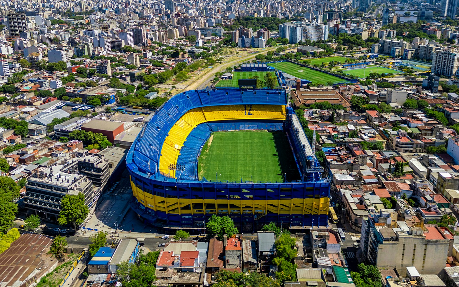 Aerial view of La Bombonera stadium in Buenos Aires, Argentina, showcasing its iconic horseshoe shape.