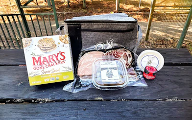 Fresh California picnic spread with crackers, meats, and cheese at Glen Blair Junction, Skunk Train.