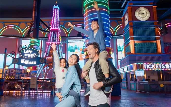 Family enjoying rides at Genting Skytropolis Indoor Theme Park, Malaysia.