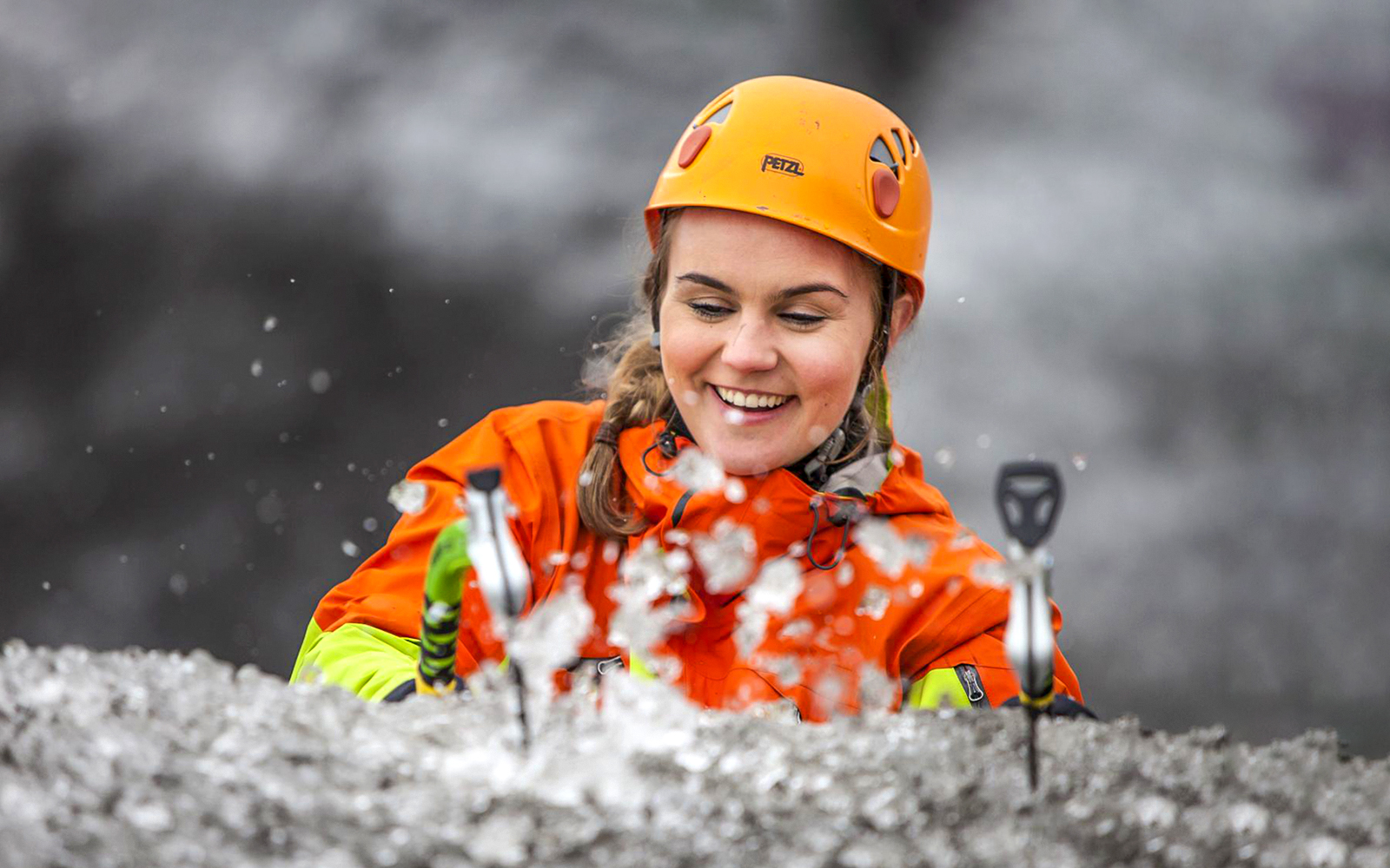 Guest ice climbing on a glacier in Skaftafell, Iceland.