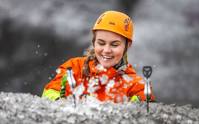 Guest ice climbing on a glacier in Skaftafell, Iceland.
