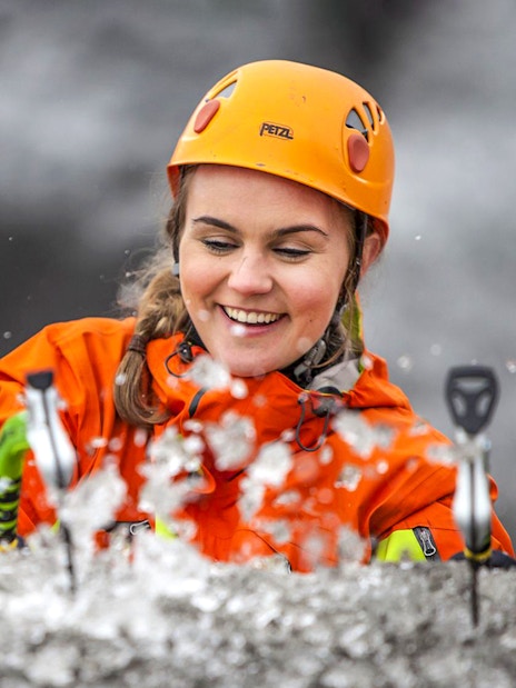 Guest ice climbing on a glacier in Skaftafell, Iceland.