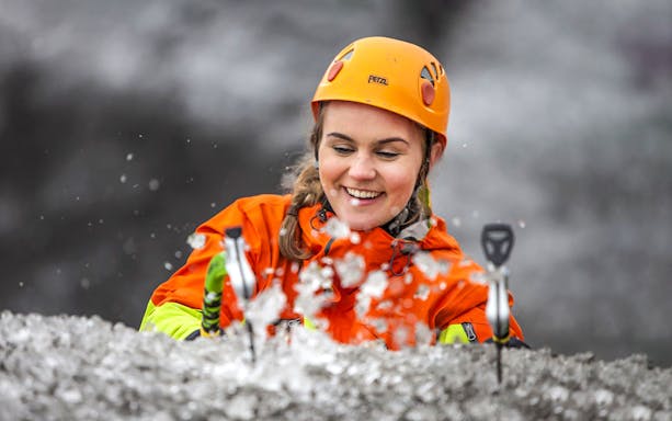 Guest ice climbing on a glacier in Skaftafell, Iceland.
