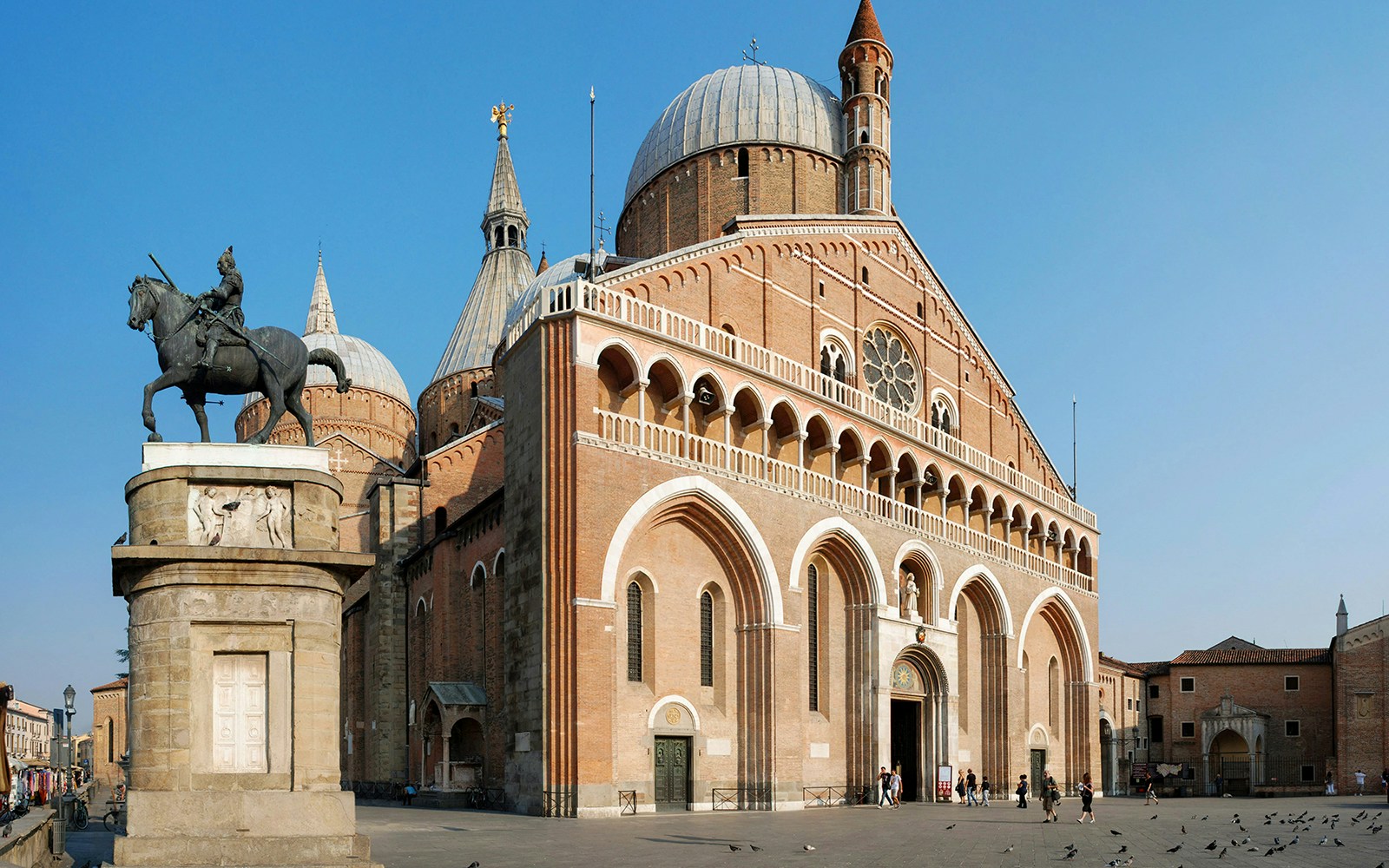 Basilica of Saint Anthony in Padua with equestrian statue in foreground.