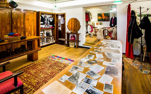 Bagella Brothers shop interior in Sassari with traditional clothing and historical photos.