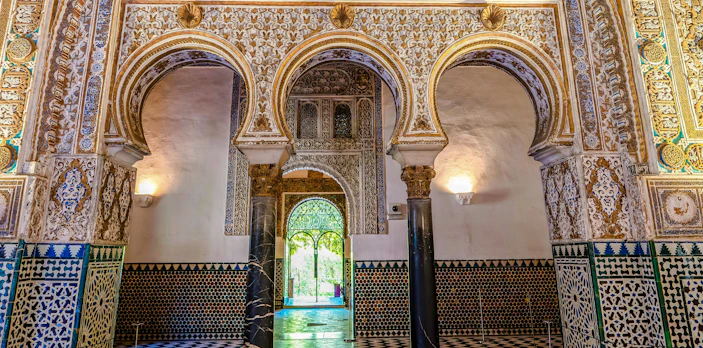 Mudejar arches and intricate tilework in the Salón de los Embajadores, Seville.