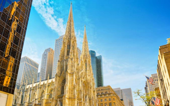 Cathedral of St. Patrick with skyscrapers in New York, USA.