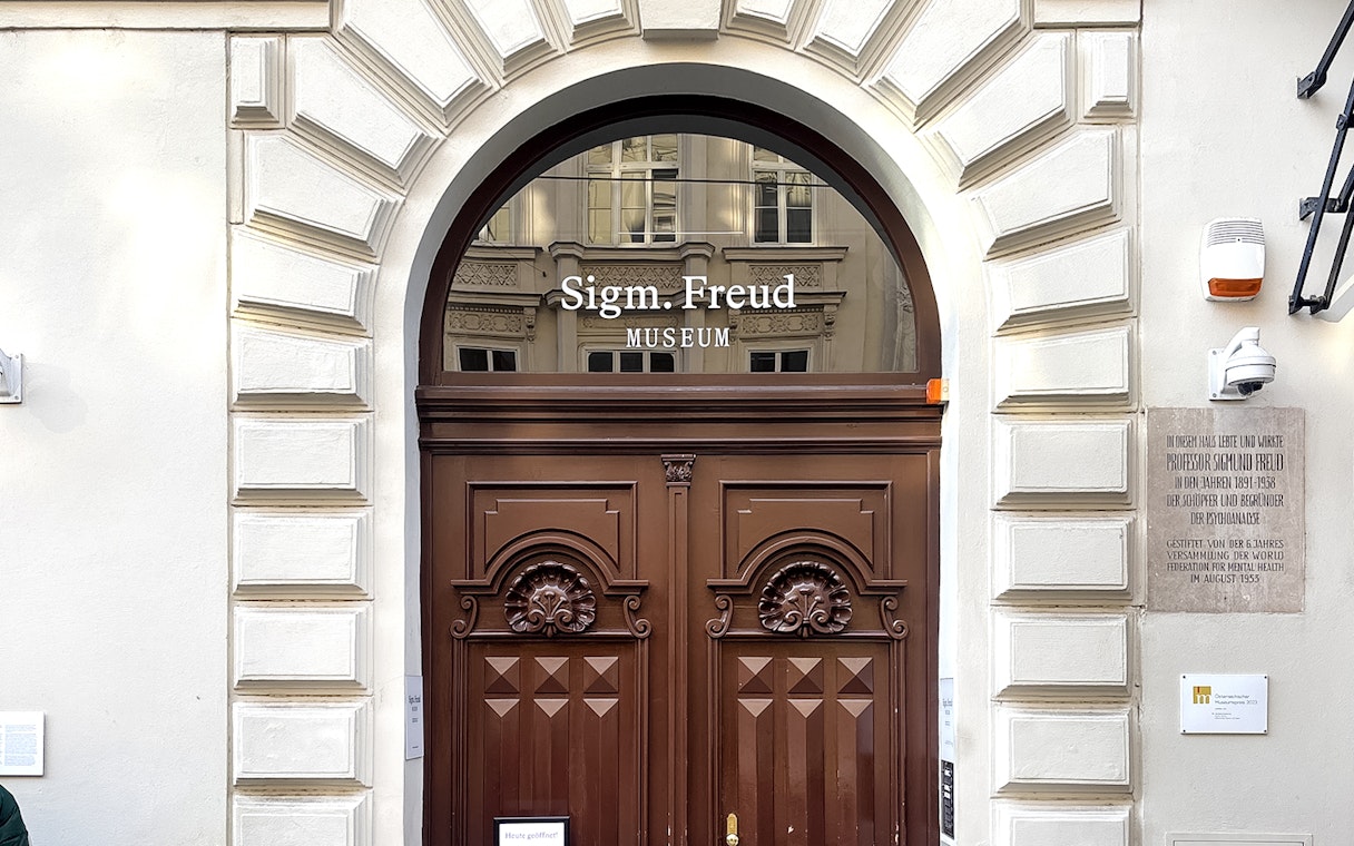 Sigmund Freud Museum entrance with wooden doors in Vienna.
