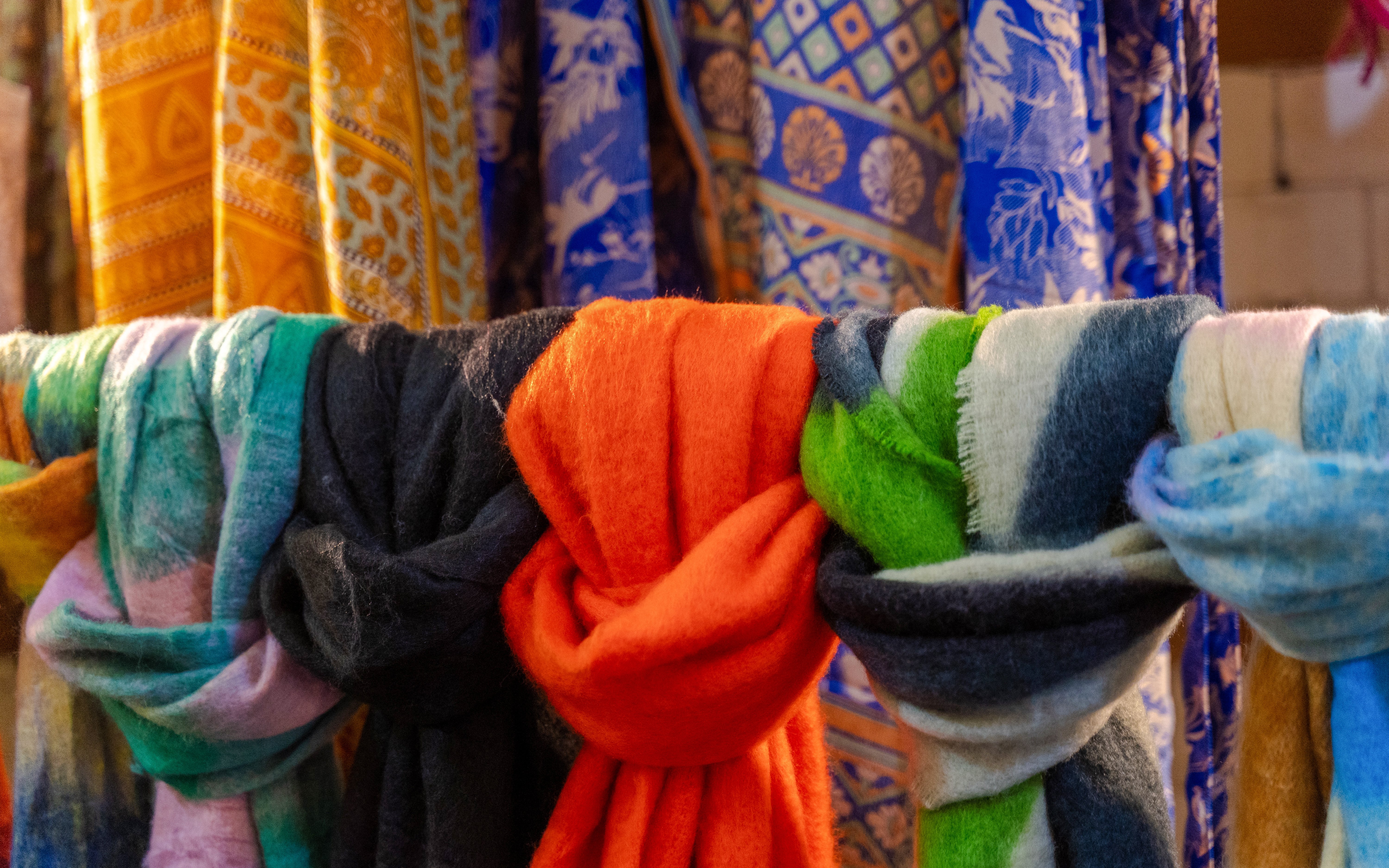 Colorful wool scarves displayed in an Irish market.