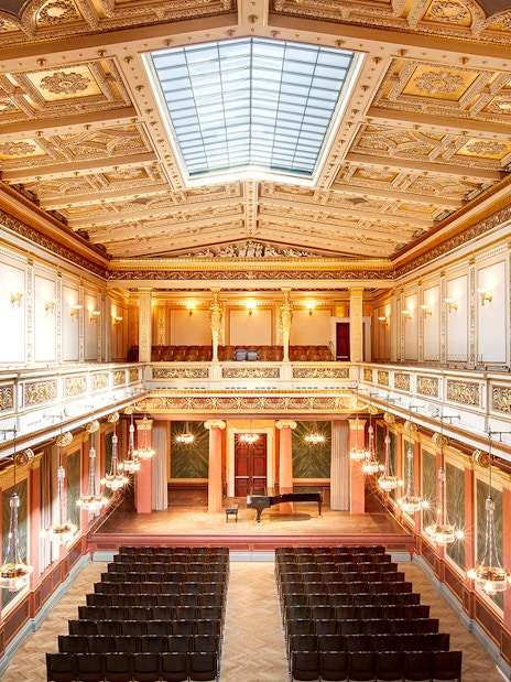 Musikverein concert hall interior with stage set for Vivaldi’s Four Seasons & Mozart concert.
