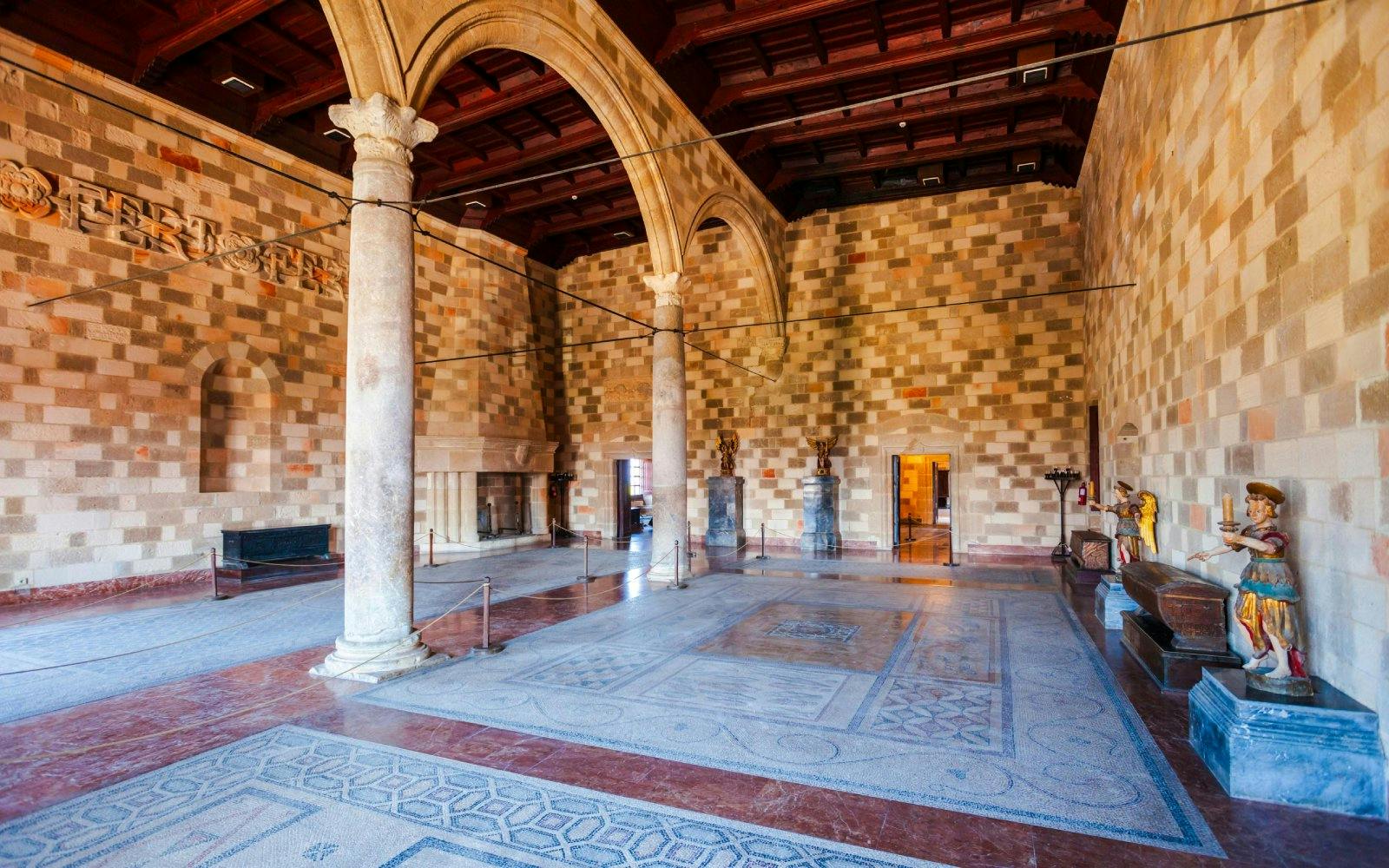 Grand hall with columns and mosaic floor inside Palace of the Grand Master of the Knights of Rhodes.