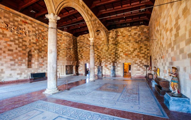 Grand hall with columns and mosaic floor inside Palace of the Grand Master of the Knights of Rhodes.
