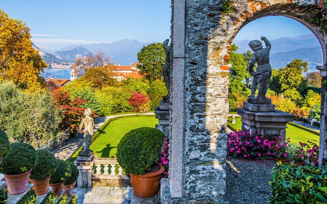 Statues and gardens at Isola Bella with Lake Maggiore in the background.
