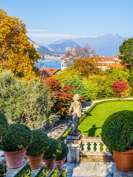 Statues and gardens at Isola Bella with Lake Maggiore in the background.
