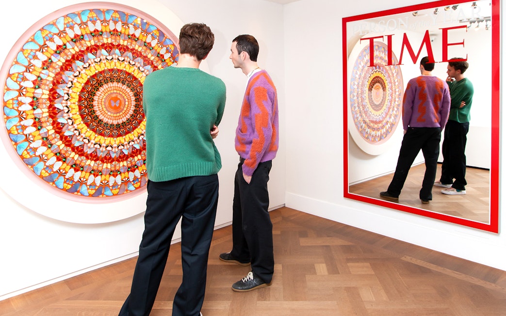 Visitors viewing contemporary art at Moco Museum, Amsterdam, featuring Banksy pieces.