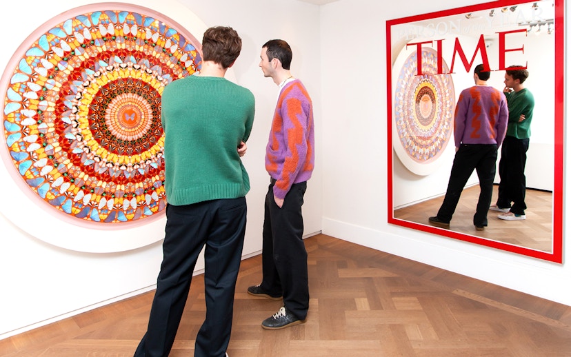 Visitors viewing contemporary art at Moco Museum, Amsterdam, featuring Banksy pieces.