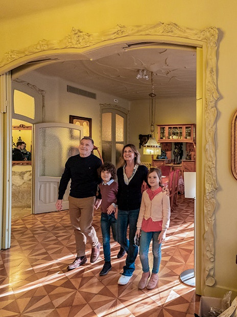 Visitors exploring an ornate room at La Pedrera-Casa Milà, Barcelona.