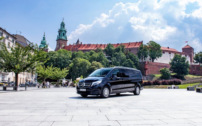 Private transfer van in front of Wawel Castle, Krakow.