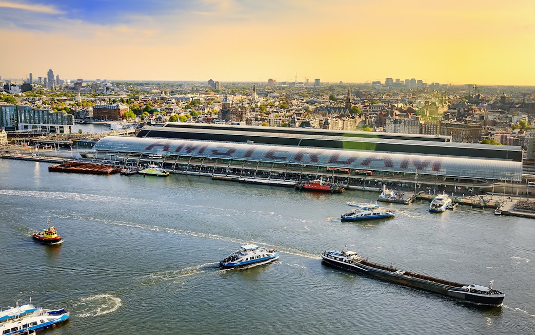 Amsterdam cityscape view from Lookout with boats on the IJ River.