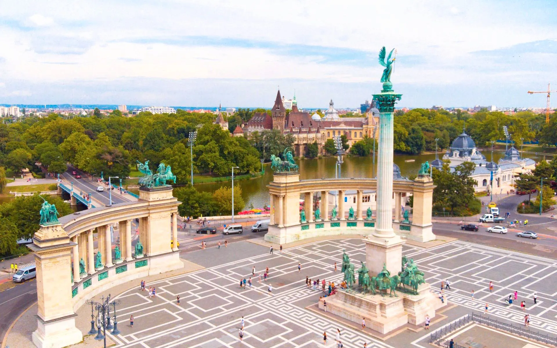 Heroe's Square with Millennium Monument in Budapest, Hungary, featuring statues and colonnade.