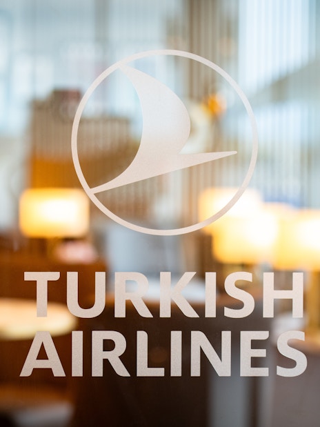 Turkish Airlines Lounge entrance at Edinburgh Airport with seating area in background.