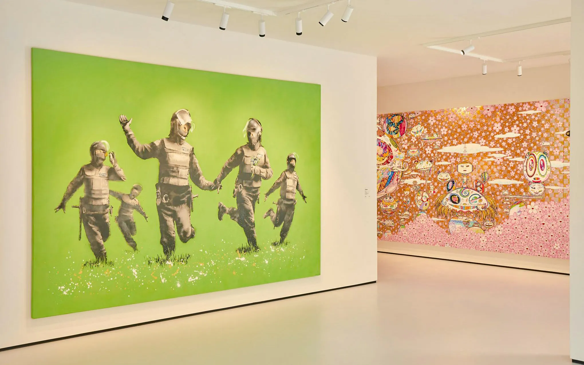 Art installations inside Moco Museum, London featuring vibrant murals and contemporary pieces.
