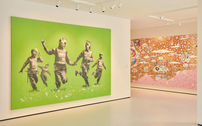 Art installations inside Moco Museum, London featuring vibrant murals and contemporary pieces.