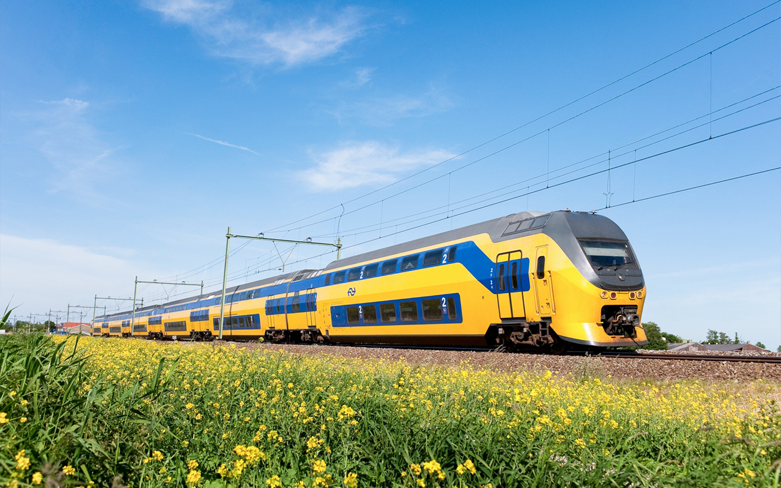 NS train traveling between Schiphol Airport and Amsterdam.