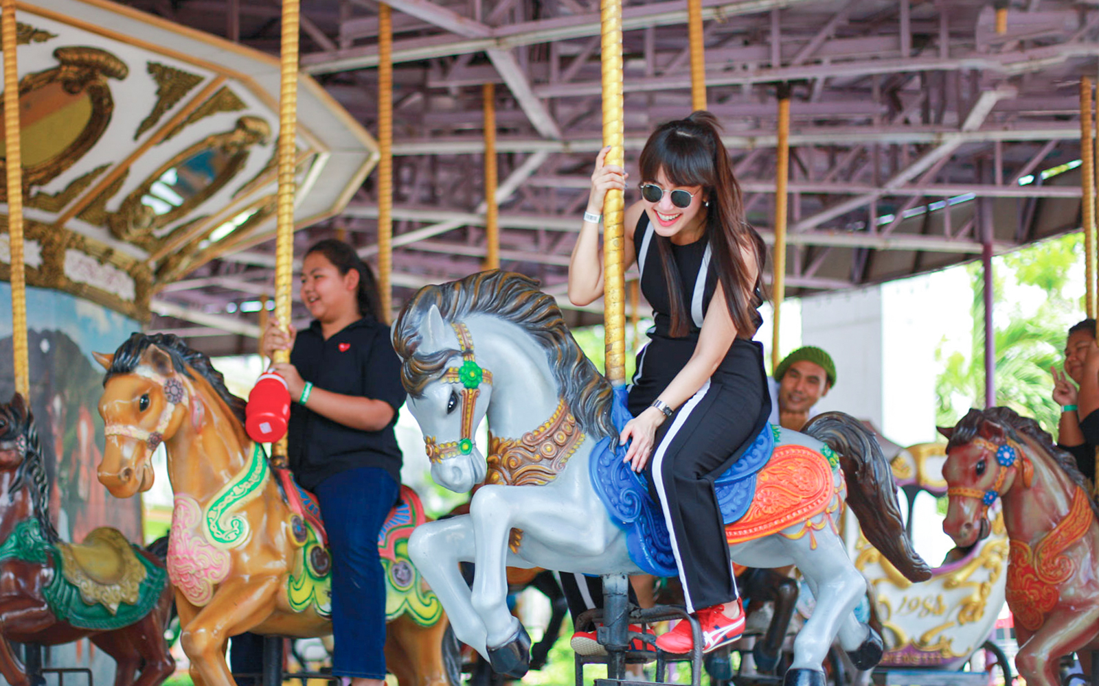 Children enjoying rides at Small World in Siam Amazing Park, Bangkok, Thailand.