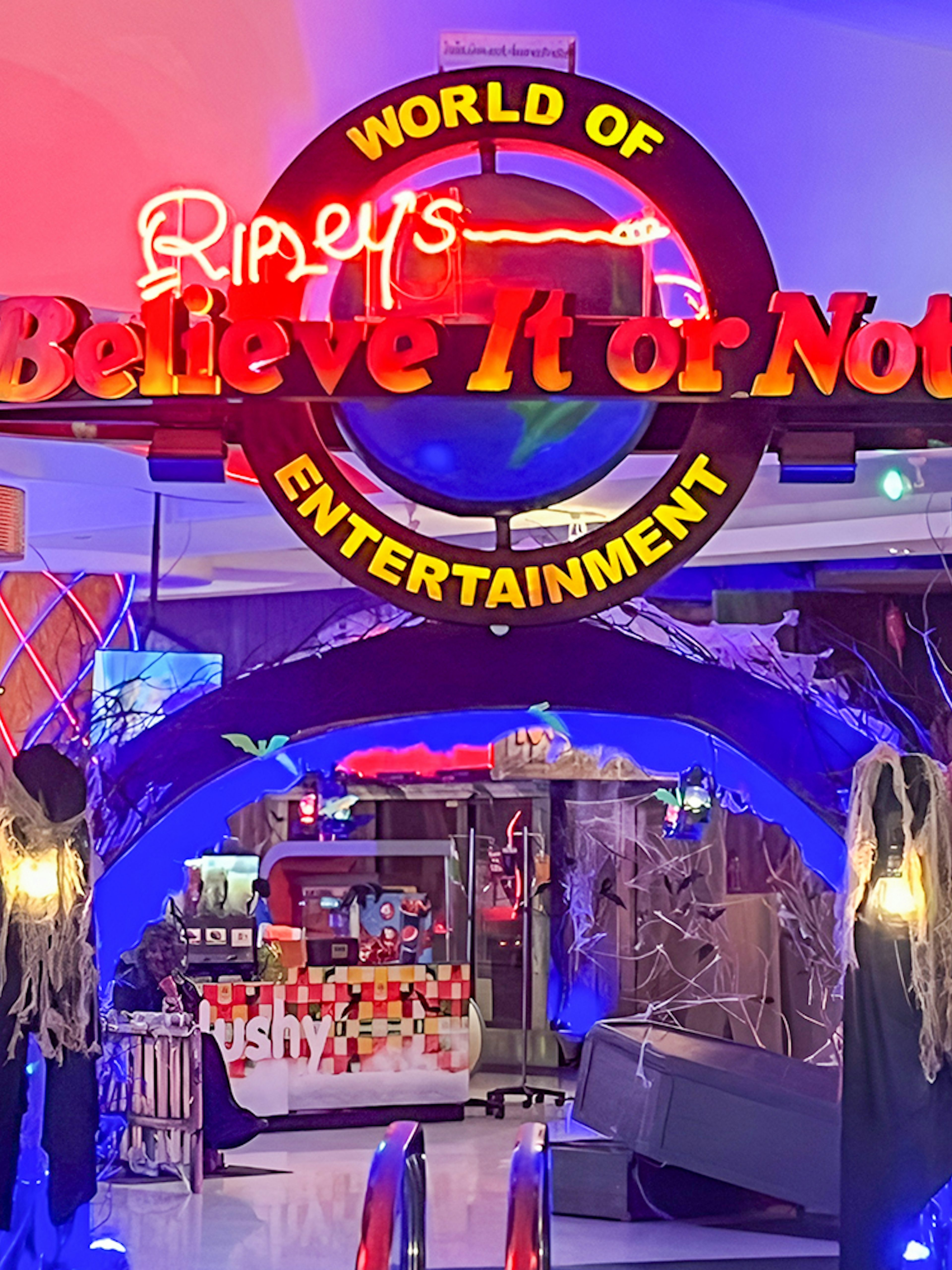 Ripley's Believe It Or Not! Museum entrance with neon sign and spooky decor.