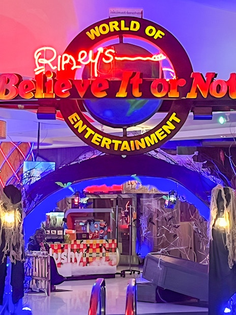 Ripley's Believe It Or Not! Museum entrance with neon sign and spooky decor.