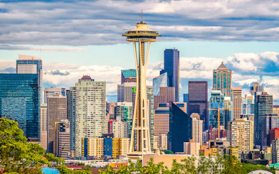 Space Needle with Seattle skyline on Hop-On Hop-Off Bus tour.