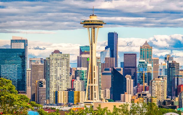 Space Needle with Seattle skyline on Hop-On Hop-Off Bus tour.